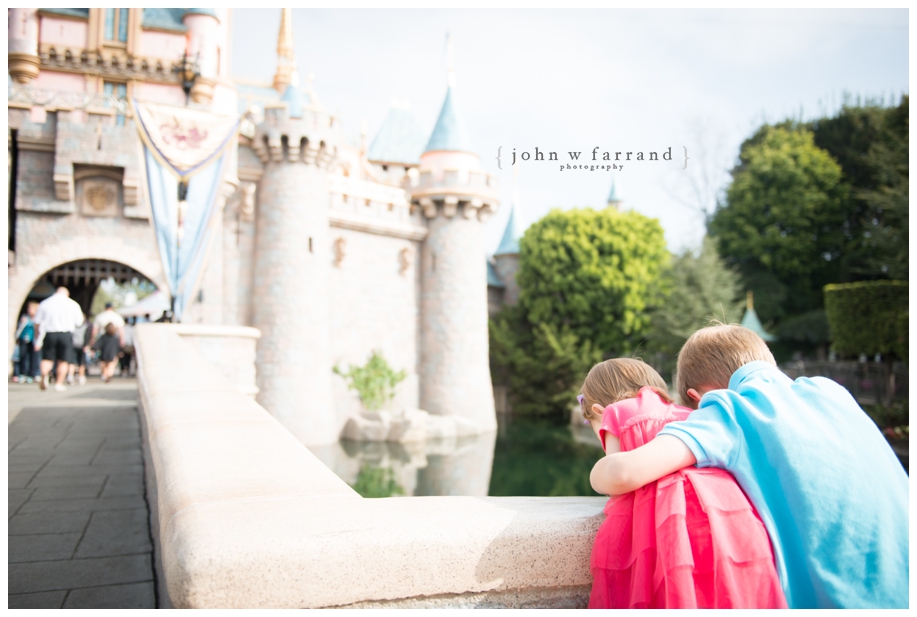 Disneyland-Family-Photographer - Watching the ducks in front of Sleeping Beauty Castle.