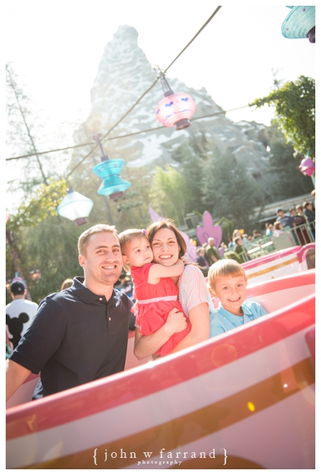 Disneyland Family Photographer - Posing on the Tea Cups in front of the Matterhorn.