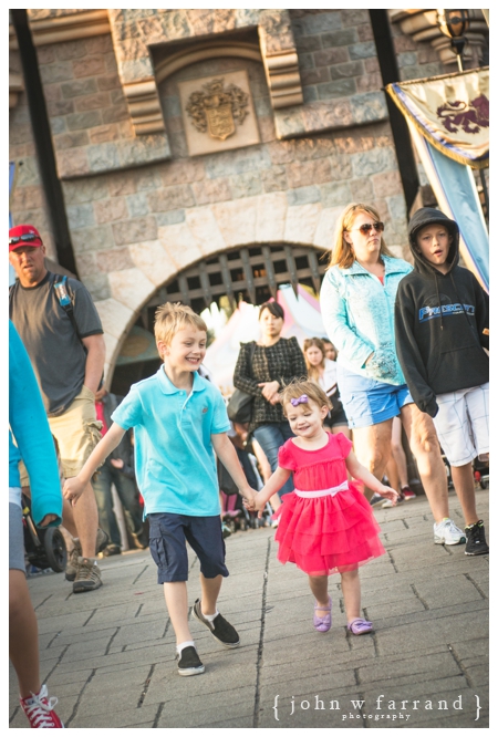 Disneyland Family Photographer - Only partially staged here.  Brother and sister loved running to and from the Castle!